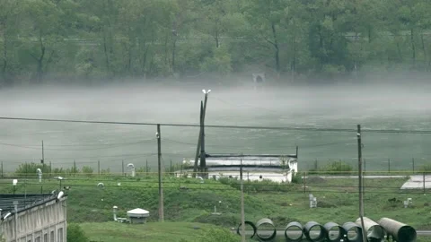 Time lapse. fog over a river in an industrial area. copy space Stock Footage 130267463