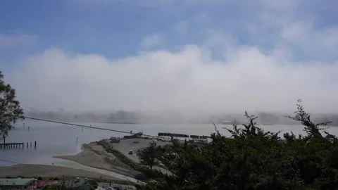 Time-Lapse of Fog Rolling Over a Lake Stock Footage 246717225