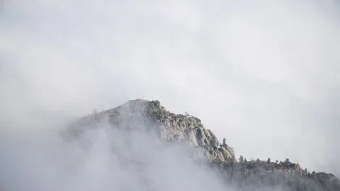 Time lapse of fog rolling over mountain peak outside Boulder, Colorado Stock Footage 254780885