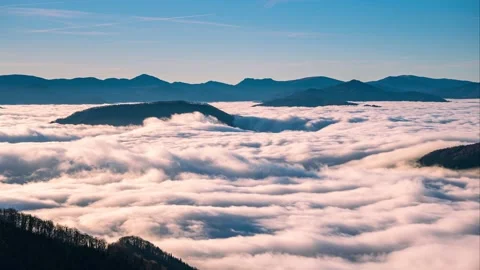 Time lapse of Foggy clouds flows like a river in misty mountains nature Stock Footage 170655740