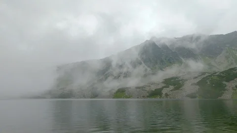 Time lapse. Foggy misty mountains and lake. Clouds moving. Zakopane Poland Stock Footage 113787053