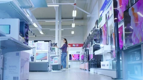 Time-Lapse Footage of Busy Day in a Modern Electronics Store Where Many People. Stock Footage