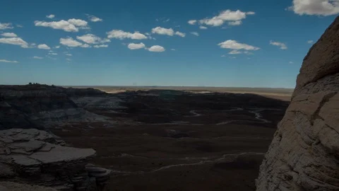 Time lapse footage of clouds drifting over the Painted Desert in Arizona. Stock Footage 122975637
