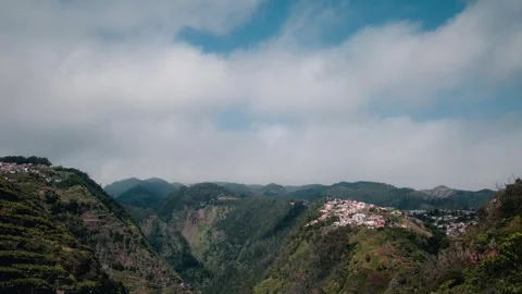 Time-Lapse Footage Of Clouds Moving By A Group Of Mountains in Madeira Stock Footage 304766393