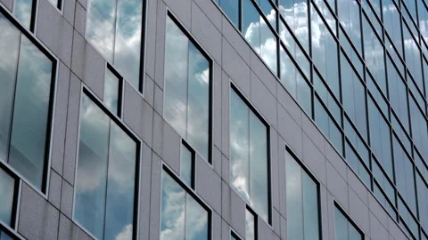 Time lapse footage of clouds reflected in skyscraper Stock Footage 141204726