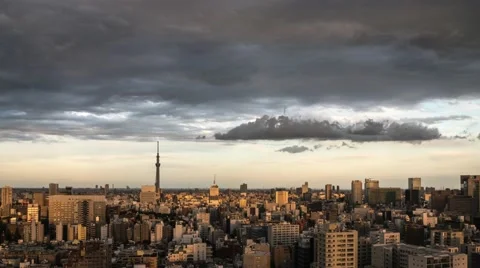 Time-lapse footage of dramatic sky over Tokyo cityscape before sunset, Tokyo, Stock Footage 68517068