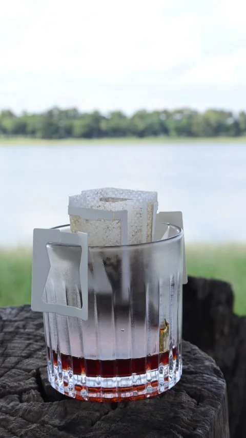 Time-lapse Footage of Portable Drip Coffee Being Poured with Hot Water Stock-Footage 334847385