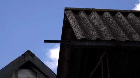Time lapse footage of white clouds above rooftops 스톡 동영상 135505760