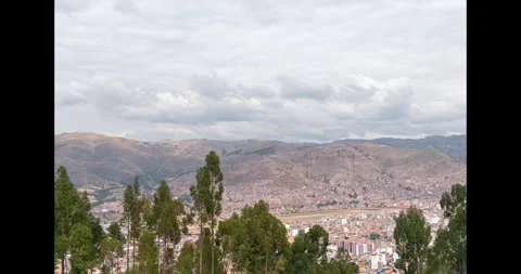 Time lapse of forest with city and distant mountains Stock Footage 293093612