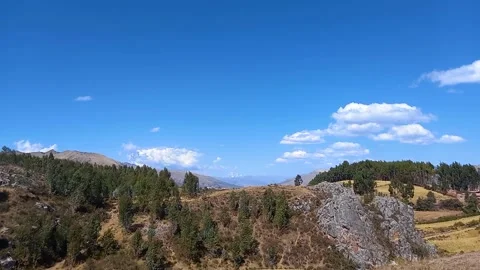 Time lapse of forest, rocks and distant clouds Stock Footage 293093484
