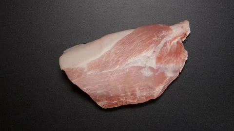TIME-LAPSE: Freezing a pork steak on black table Stock Footage 70221618