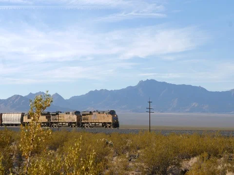 Time lapse freight train passing through in desert setting Stock-Footage 82877402