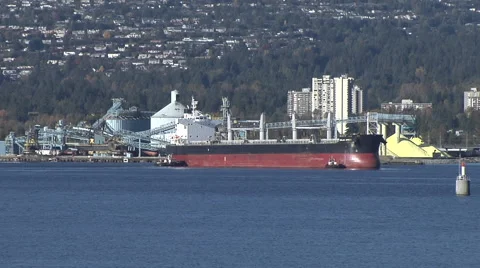 Time Lapse of Freighter being manouverd into a dock Stock Footage 53052420