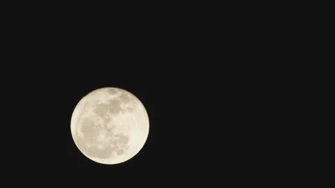 Time-lapse of Full moon against black sky at night Stock Footage 103785051