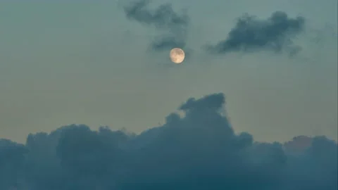 Time lapse of Full moon and sunset clouds and beautiful sunset clouds passing Stock Footage 136690044