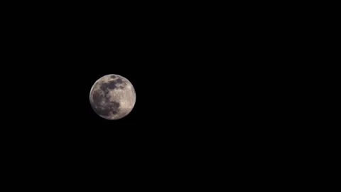 Time lapse of full moon on black background Stock Footage 138878884