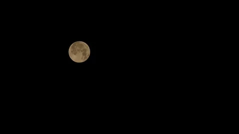 Time lapse of full moon on clear black sky Stock Footage 92965900