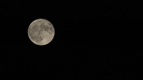 Time lapse of full moon in clear sky, left to right movement. Stock Footage 140482043