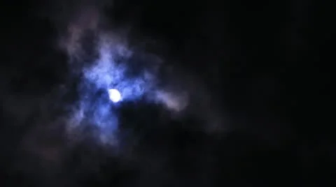 Time Lapse of full moon at night as clouds move pass rapidly. Stock Footage 12203096