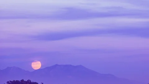 Time Lapse - Full Moon Rises from Mountain Range - 4K Stock Footage 84876289