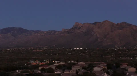 Time lapse: Full moon rising over Santa Catalina mountains, Arizona Stock Footage 34348845
