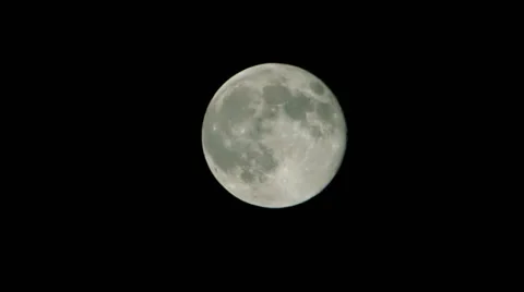 Time lapse of the full moon rising across screen. Video stock 34490187