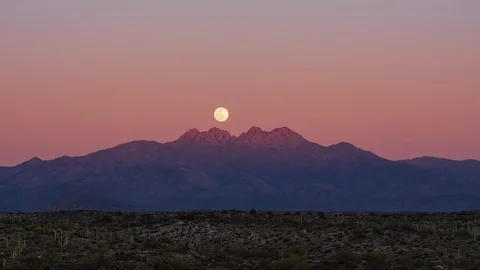 Time Lapse of the Full Moon Rising over Four Peaks in Arizona Stock Footage