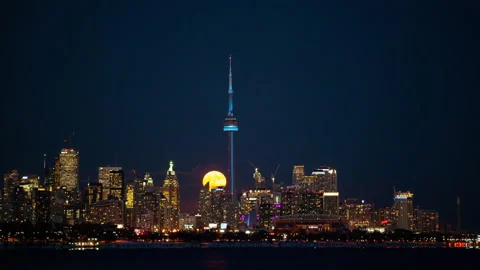 Time lapse of a full moon rising above the Toronto skyline Stock Footage 133205892