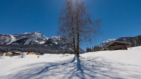 Time lapse - Full moon winter night with fresh snow and the moon moving Видео 99373610