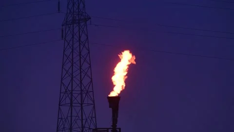 Time lapse gas flare stack burning excess gases at petrochemical plant uk Stock Footage 191012887