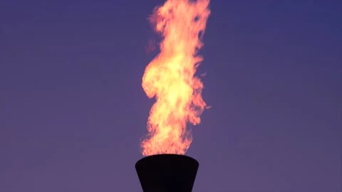 Time lapse gas flare stack burning excess gases at petrochemical plant uk Stock Footage 191021799