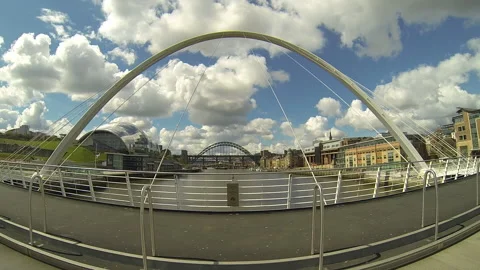 Time lapse Gateshead Millenium Bridge with pedestrians on walkway Stock Footage 159159328