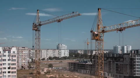 Time lapse of giant yellow constructor crane work on a building site Stock Footage 143563330