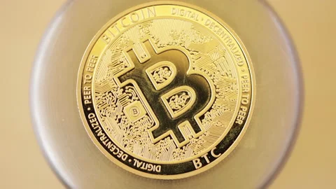 Time lapse of golden Bitcoin Stock Footage 130828193