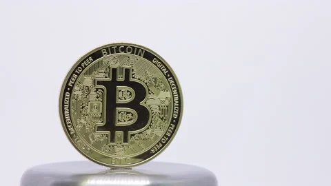 Time lapse of golden Bitcoin. Rotating bitcoin on white background Stock Footage 144331408