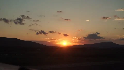 Time lapse of a golden sunset between the mountains Stock Footage 143940387