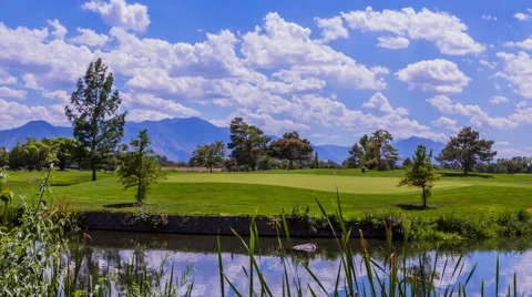 Time lapse of golf course players with clouds Stock Footage 40888021