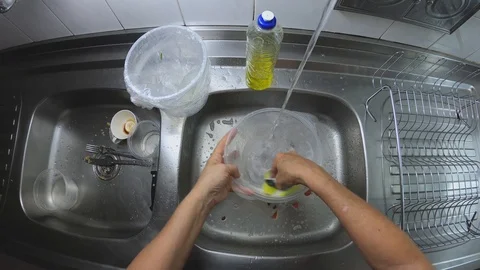 Time lapse. Gopro wide angle. Dish washing routine. Woman washes glasses. Stock Footage 128004036