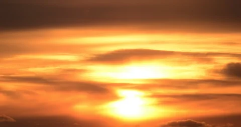 Time lapse: Gorgeous spring sunset behind clouds over mountain trees 24fps zoom Stock Footage 85984306