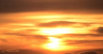 Time lapse: Gorgeous spring sunset behind clouds over mountain trees 30fps zoom Stock Footage 85984336