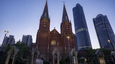 Time Lapse: Gothic Spires of Xujiahui Cathedral Against Shanghai Skyscrapers Stock Footage 337899369