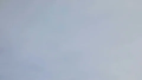 A time lapse of the gray clouds running across sky Stock Footage 103338254