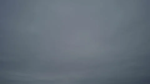 Time lapse, gray stratus clouds moving quickly across the sky waiting for rain Stock Footage 302084726