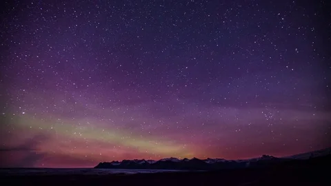 Time Lapse - Green and Pink Colored Northern Lights over the Mountains Stock Footage 80451810