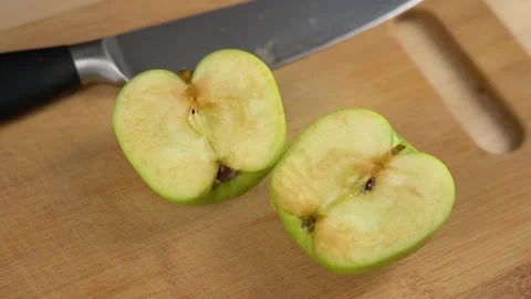 Time lapse green apple cut half and oxidised. Turning fresh into oxidised brown. Stock Footage 166789034