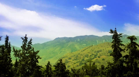 Time lapse green mountain blue sky Stock Footage 32578136