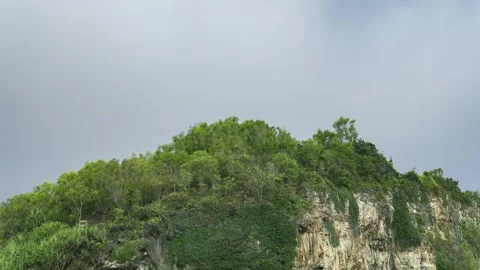 Time-lapse of a green peak with a cloudy sky Stock Footage 251140273