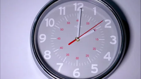Time-Lapse of Grey Circular Wall Clock With Red Second Hand 動画素材 337137966
