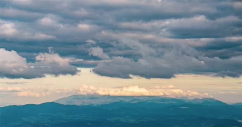 Time lapse of Grey Clouds moving fast over nature landscape Stock Footage 299310487