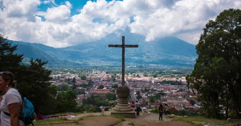 Time Lapse of group of tourists walking near the crucifix in Guatemala City Stock Footage 64401025